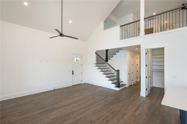 1230 Melton Rd Unit 211, West Union, SC 29696 - unfurnished living room with stairway, baseboards, high vaulted ceiling, a ceiling fan, and dark wood-type flooring