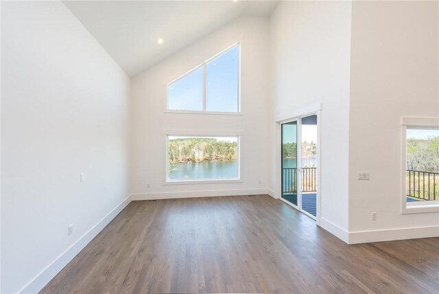 1230 Melton Rd Unit 211, West Union, SC 29696 - unfurnished living room featuring wood finished floors, high vaulted ceiling, and baseboards