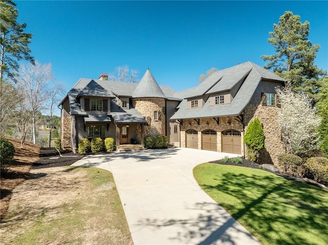 view of front facade featuring a front yard and a garage