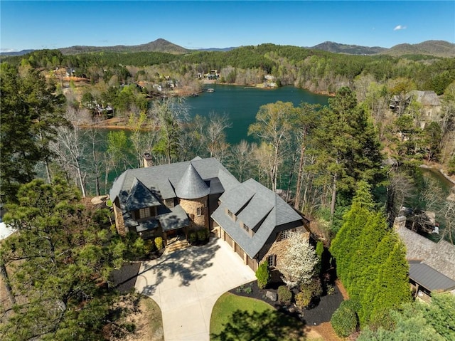 birds eye view of property featuring a water and mountain view