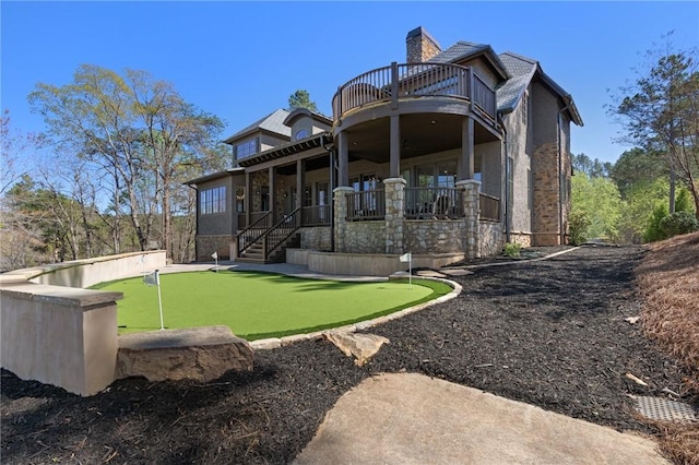 rear view of house with a balcony