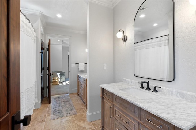 bathroom featuring vanity and crown molding