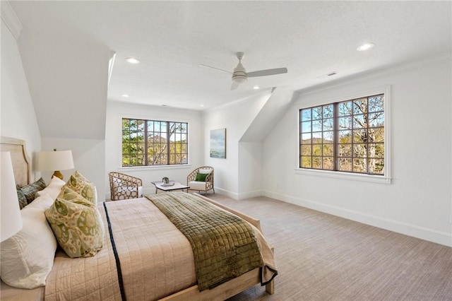 bedroom with ceiling fan, lofted ceiling, ornamental molding, and multiple windows