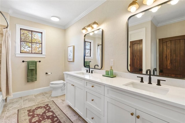 bathroom featuring vanity, toilet, and crown molding