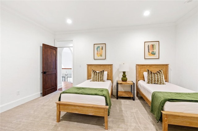 carpeted bedroom featuring crown molding