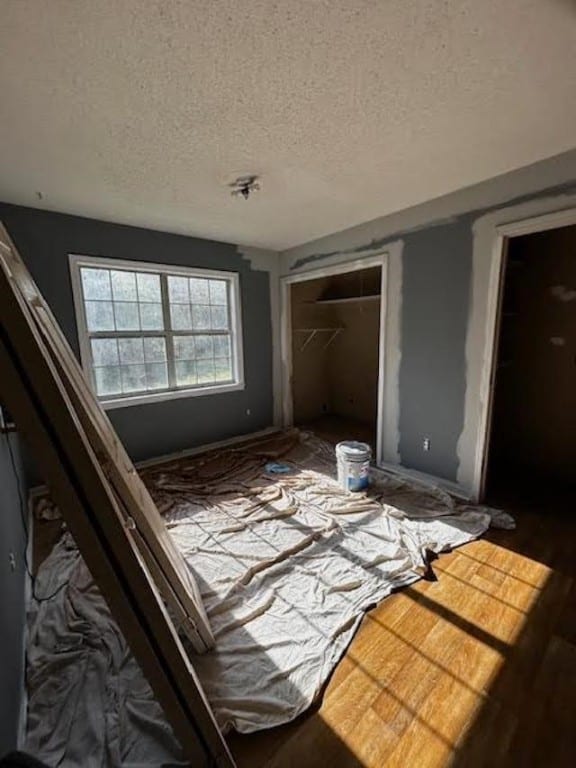 miscellaneous room with a textured ceiling