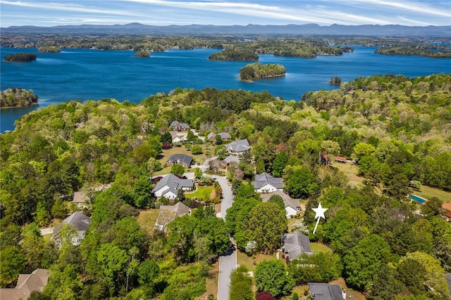 drone / aerial view with a water and mountain view