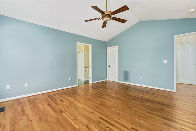 unfurnished room featuring ceiling fan, light wood-type flooring, and vaulted ceiling