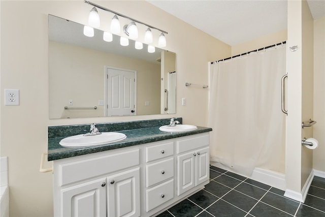 bathroom with vanity, curtained shower, and tile patterned flooring