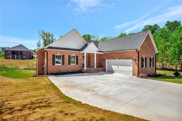 view of front facade with a front yard and a garage