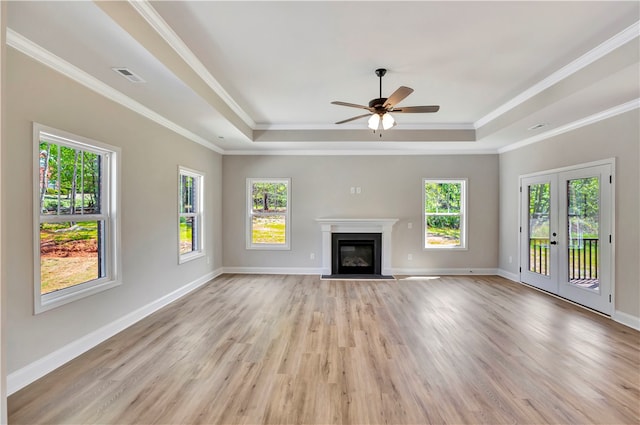 unfurnished living room with light hardwood / wood-style flooring, ceiling fan, and plenty of natural light