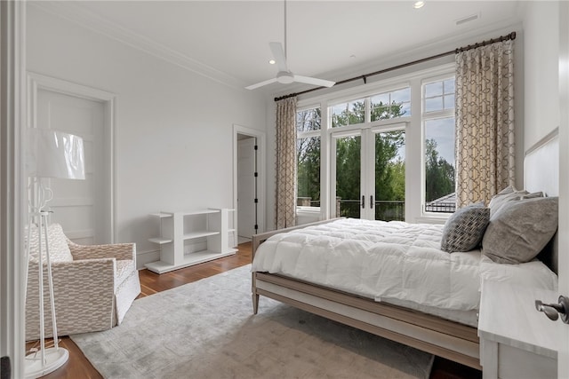 bedroom with french doors, ceiling fan, ornamental molding, and dark hardwood / wood-style floors