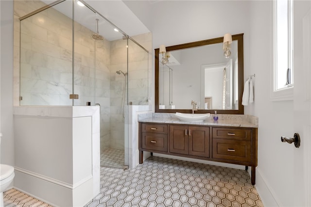 bathroom with toilet, an enclosed shower, vanity, and tile patterned flooring