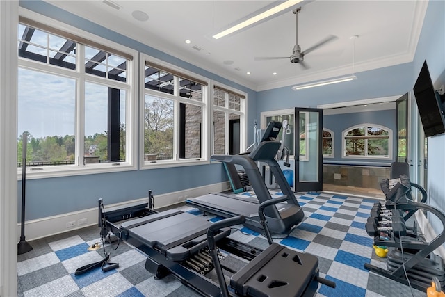 workout area featuring crown molding and ceiling fan