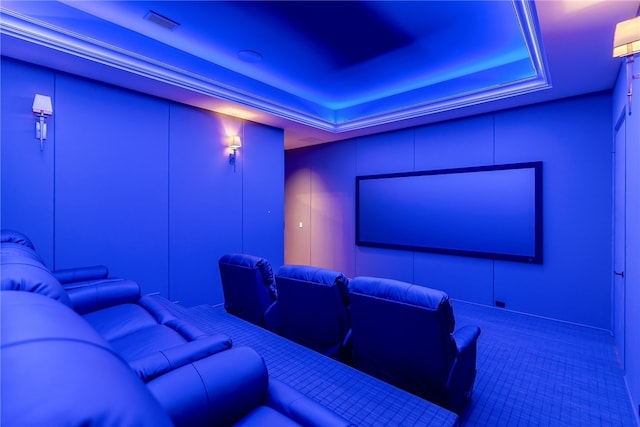 home theater featuring a raised ceiling