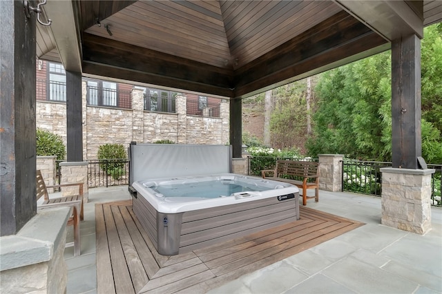 view of patio with a gazebo and a covered hot tub