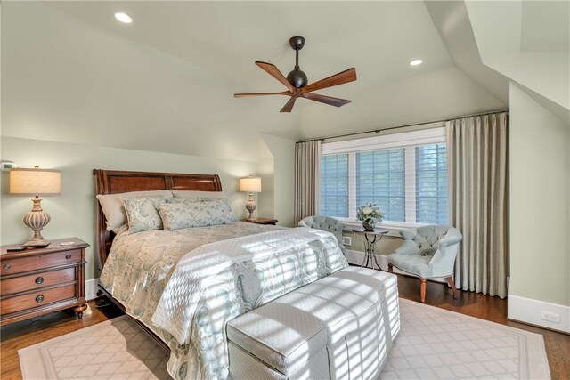 bedroom featuring ceiling fan, lofted ceiling, and dark hardwood / wood-style flooring