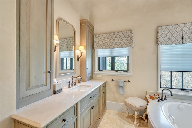 bathroom featuring a bathtub, tile patterned flooring, and vanity