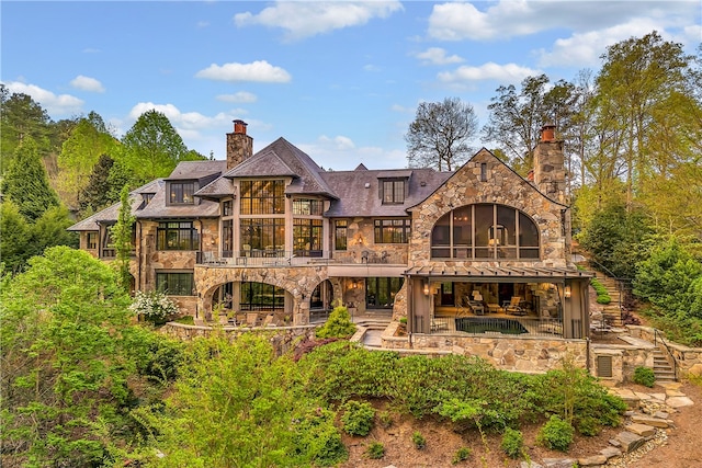 back of house featuring a patio area