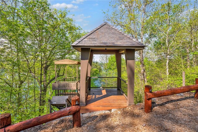 wooden terrace featuring a gazebo