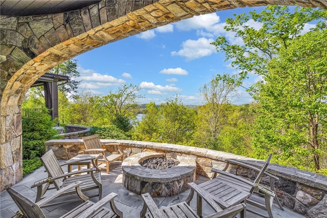 view of patio featuring an outdoor fire pit