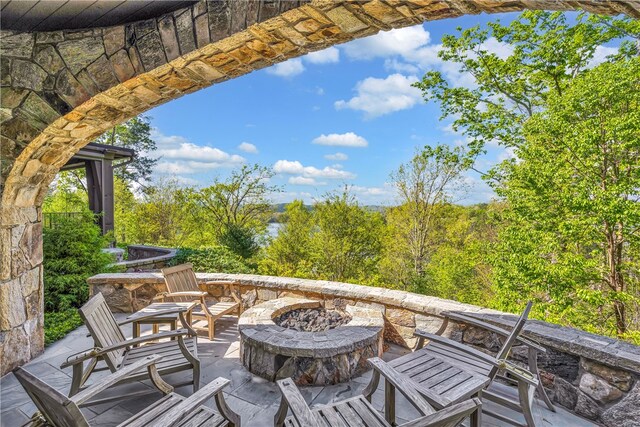 view of patio featuring an outdoor fire pit