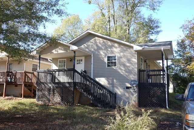 rear view of property with covered porch