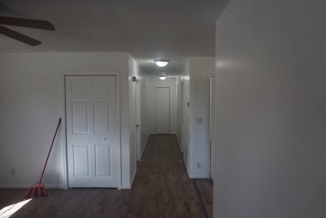 corridor with dark hardwood / wood-style floors