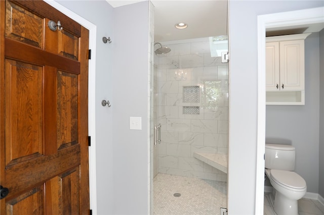 bathroom with toilet, an enclosed shower, and tile patterned floors