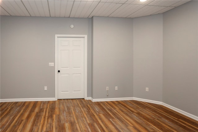 spare room featuring dark hardwood / wood-style flooring