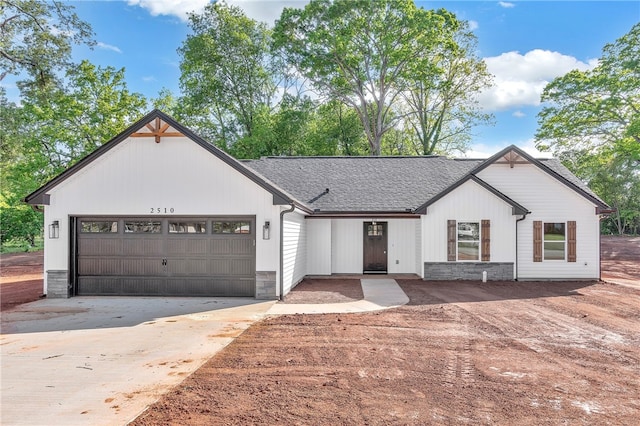 modern farmhouse with a garage