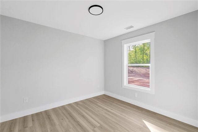 unfurnished room featuring light wood-type flooring