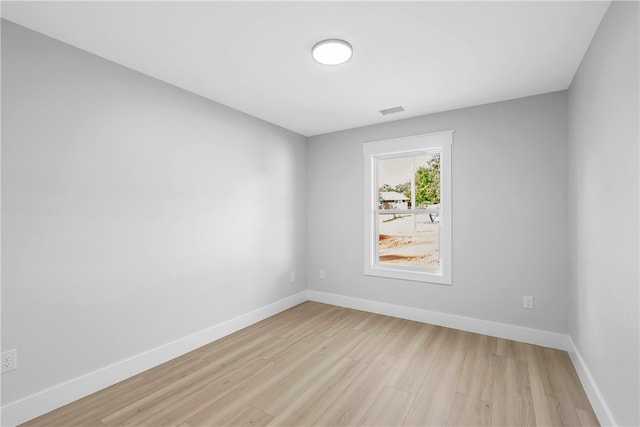 unfurnished room featuring light hardwood / wood-style floors