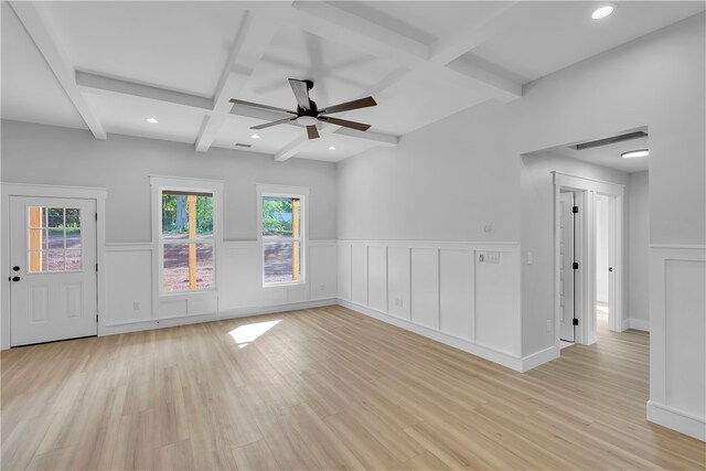 spare room with ceiling fan, beamed ceiling, light wood-type flooring, and coffered ceiling