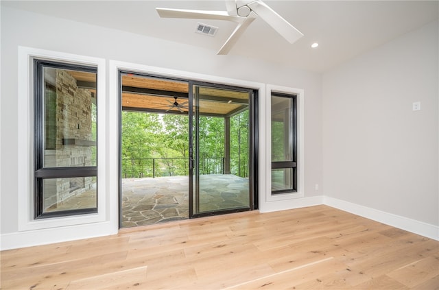 entryway with ceiling fan and light hardwood / wood-style flooring