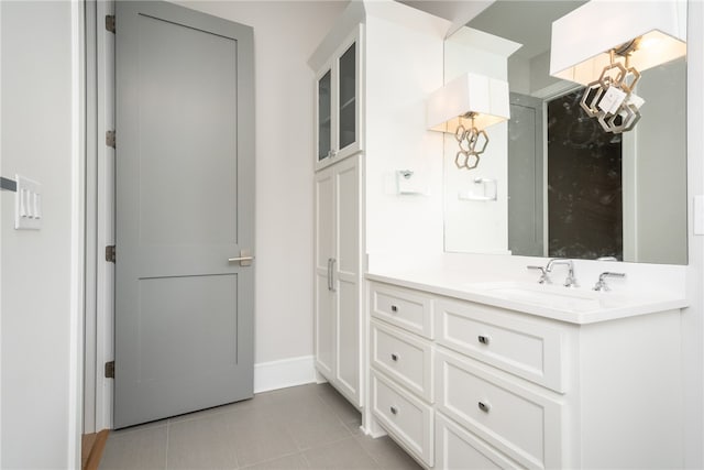 bathroom featuring tile patterned flooring and vanity