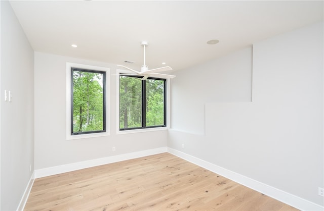 unfurnished room with light hardwood / wood-style floors