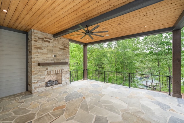 view of patio / terrace with ceiling fan and a balcony