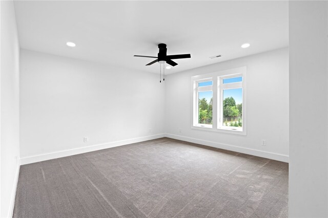 unfurnished room with carpet and ceiling fan