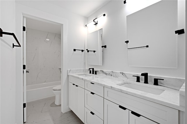 full bathroom with vanity, toilet, and tiled shower / bath