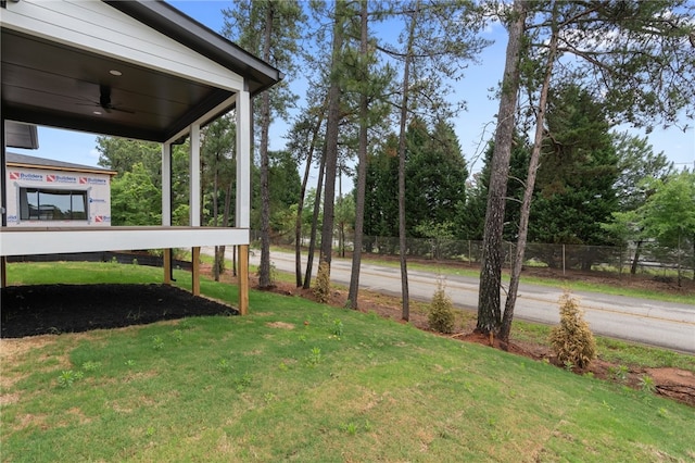 view of yard with ceiling fan