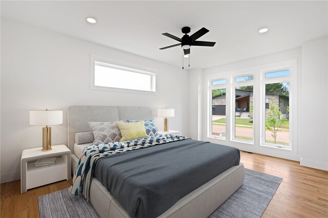 bedroom featuring ceiling fan and light wood-type flooring