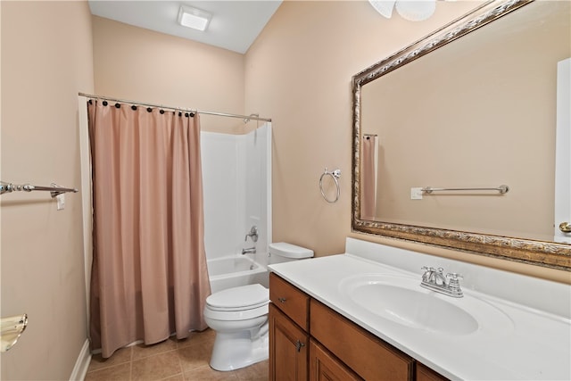 full bathroom featuring vanity, shower / bath combo with shower curtain, toilet, and tile patterned floors