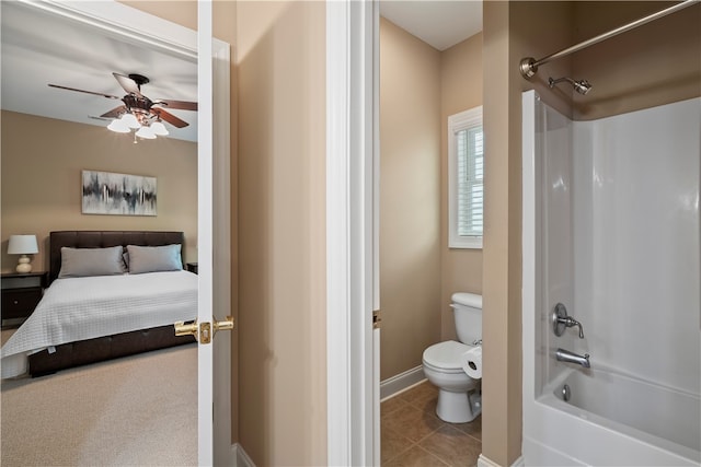 bathroom with shower / bathtub combination, toilet, ceiling fan, and tile patterned floors