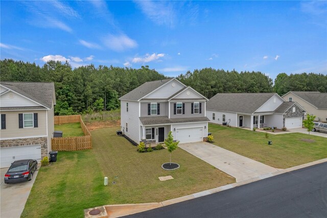 view of front of home featuring a garage and a front yard