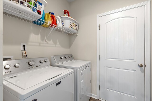 laundry area with independent washer and dryer