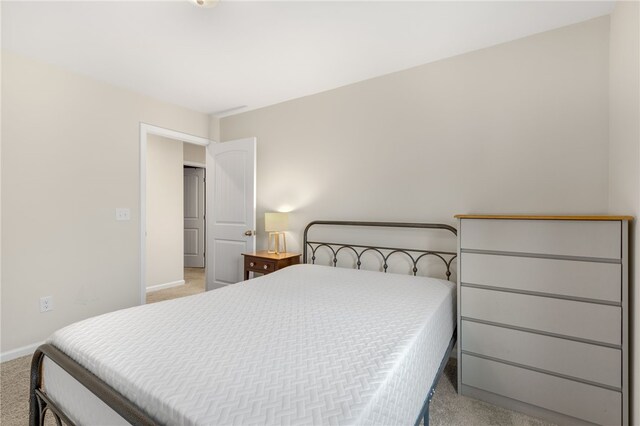 bedroom with light colored carpet