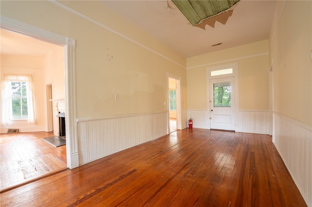 spare room featuring wood-type flooring