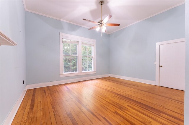 unfurnished room featuring wood-type flooring, crown molding, and ceiling fan