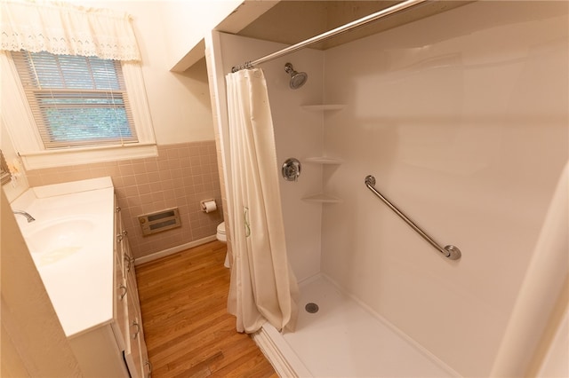 bathroom with curtained shower, hardwood / wood-style flooring, vanity, and toilet